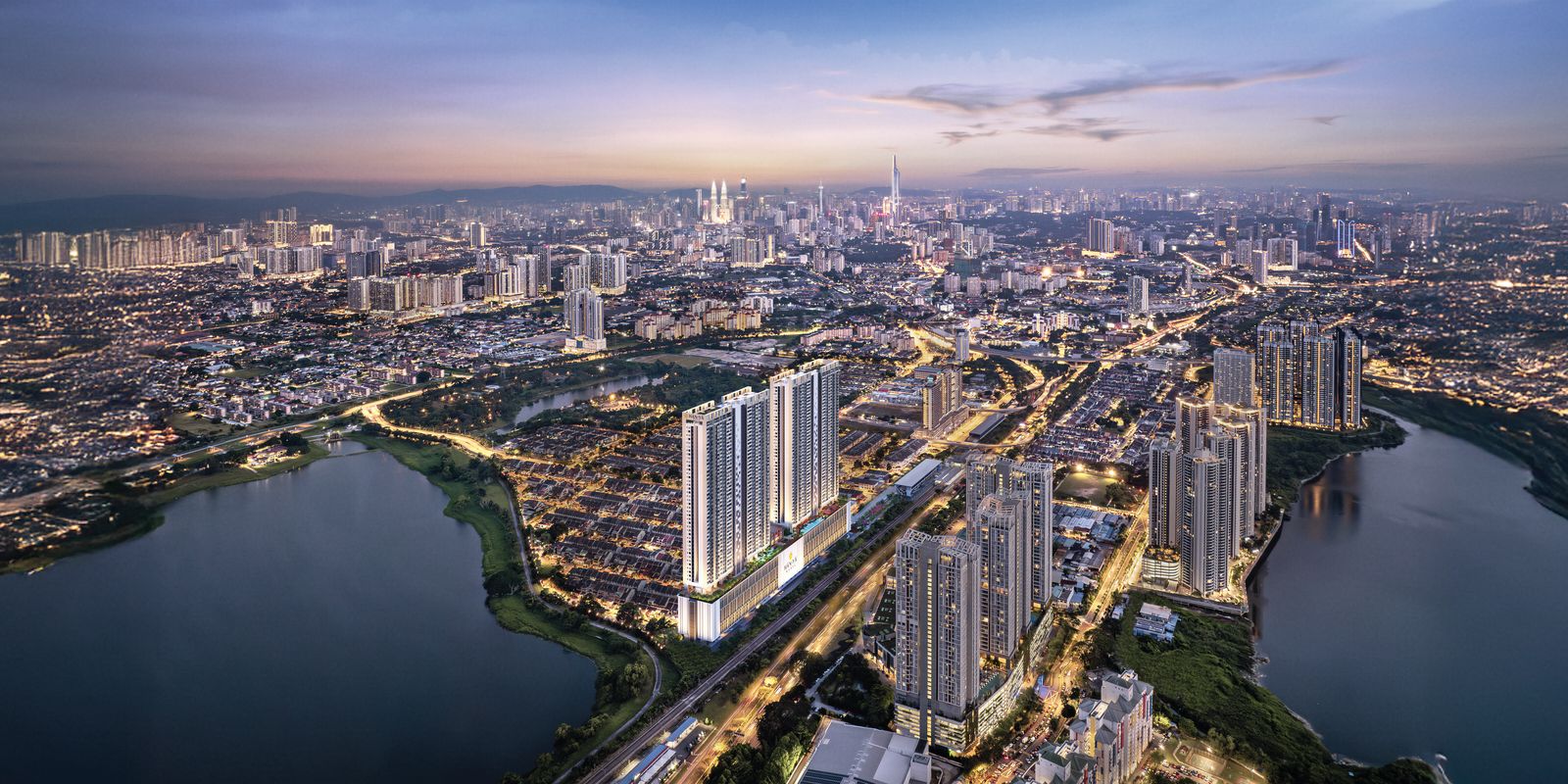 黄昏时分的 Taman Wahyu 鸟瞰:涵雅双塔立于铁道旁,前景是湖泊,远方是吉隆坡天际线